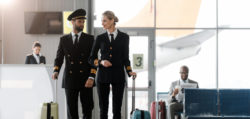 Two pilots walking in airport.